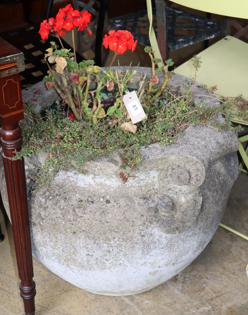 A large Grecian style reconstituted stone garden planter, 60cm diameter, H.48cm